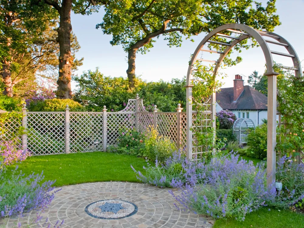English garden with a wooden arch and trellis