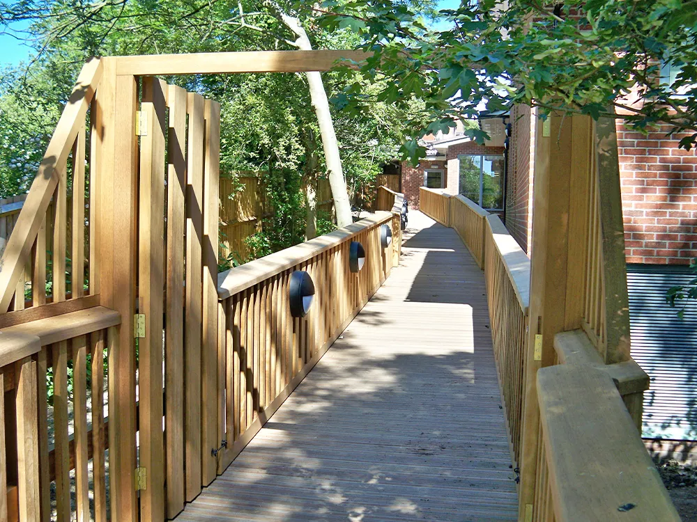 wooden bridge with outside lighting
